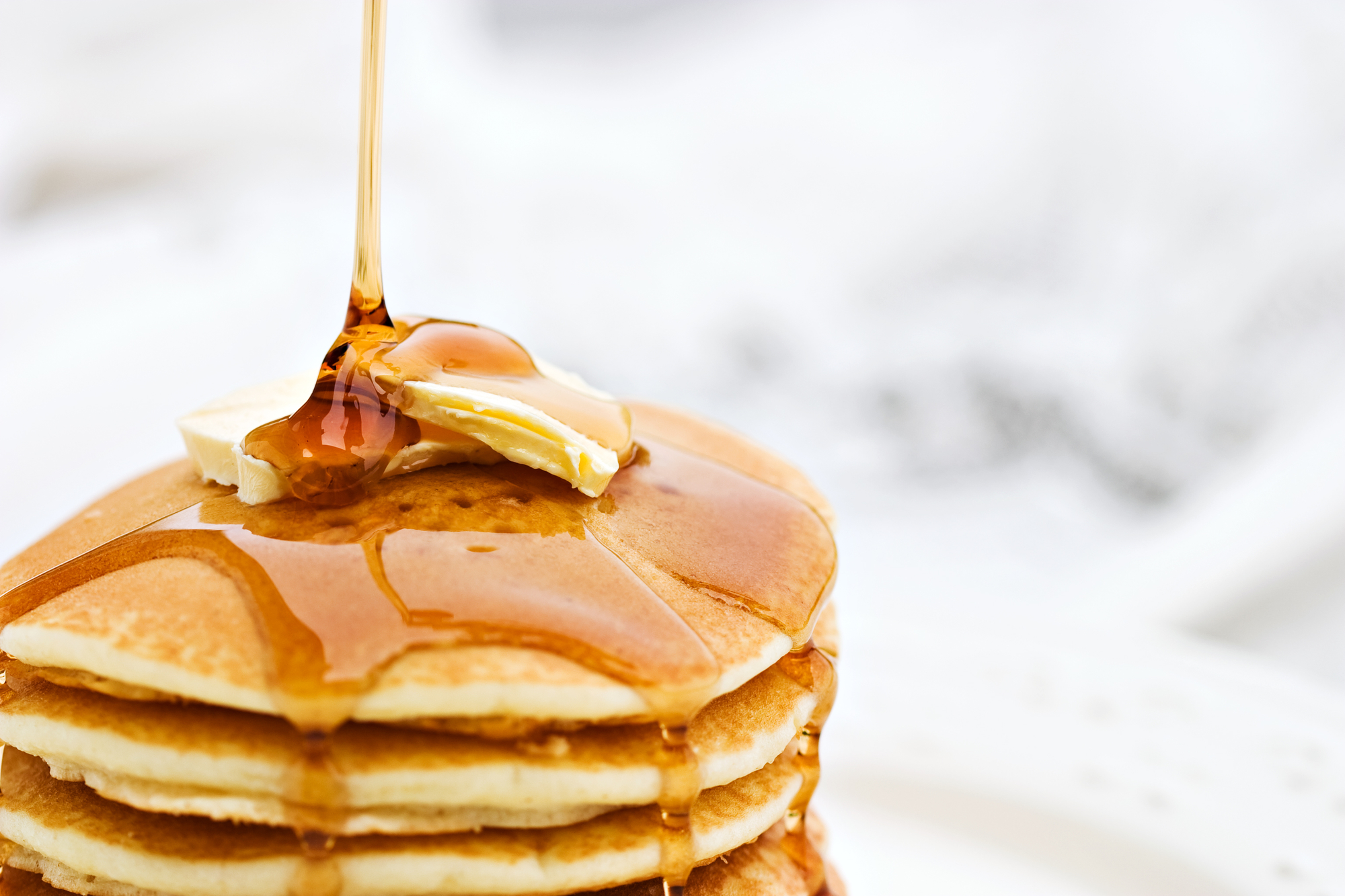 Pancake stack with butter and syrup